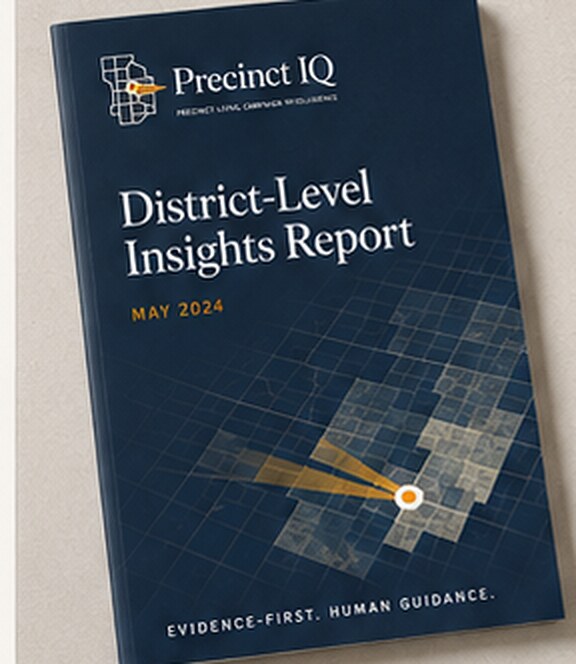 Precinct IQ District-Level Insights Report — a printed campaign intelligence brief resting on a desk.